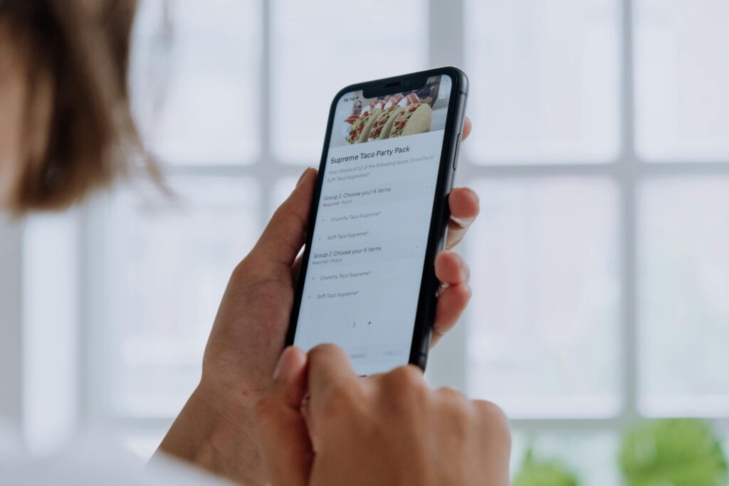 Person browsing online using a mobile phone - Assets For Life