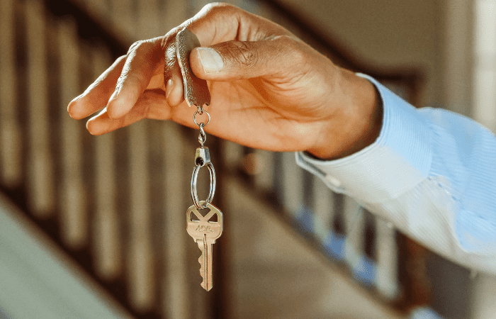 Person receiving house keys to property