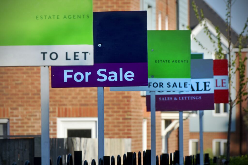 For sale signs outside of house