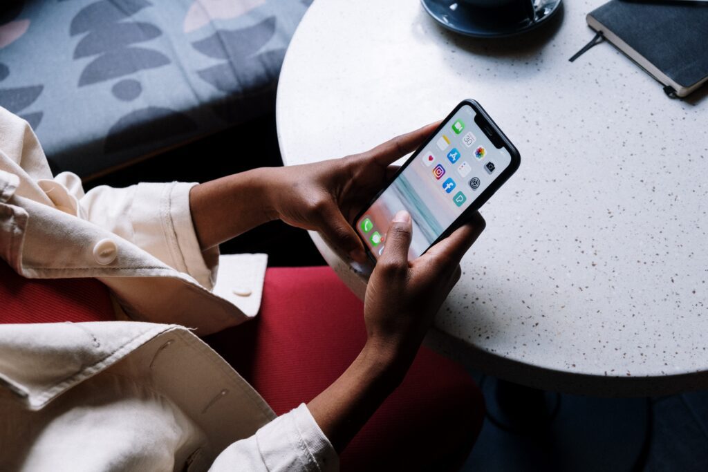 Person browsing online using a mobile phone - Assets For Life