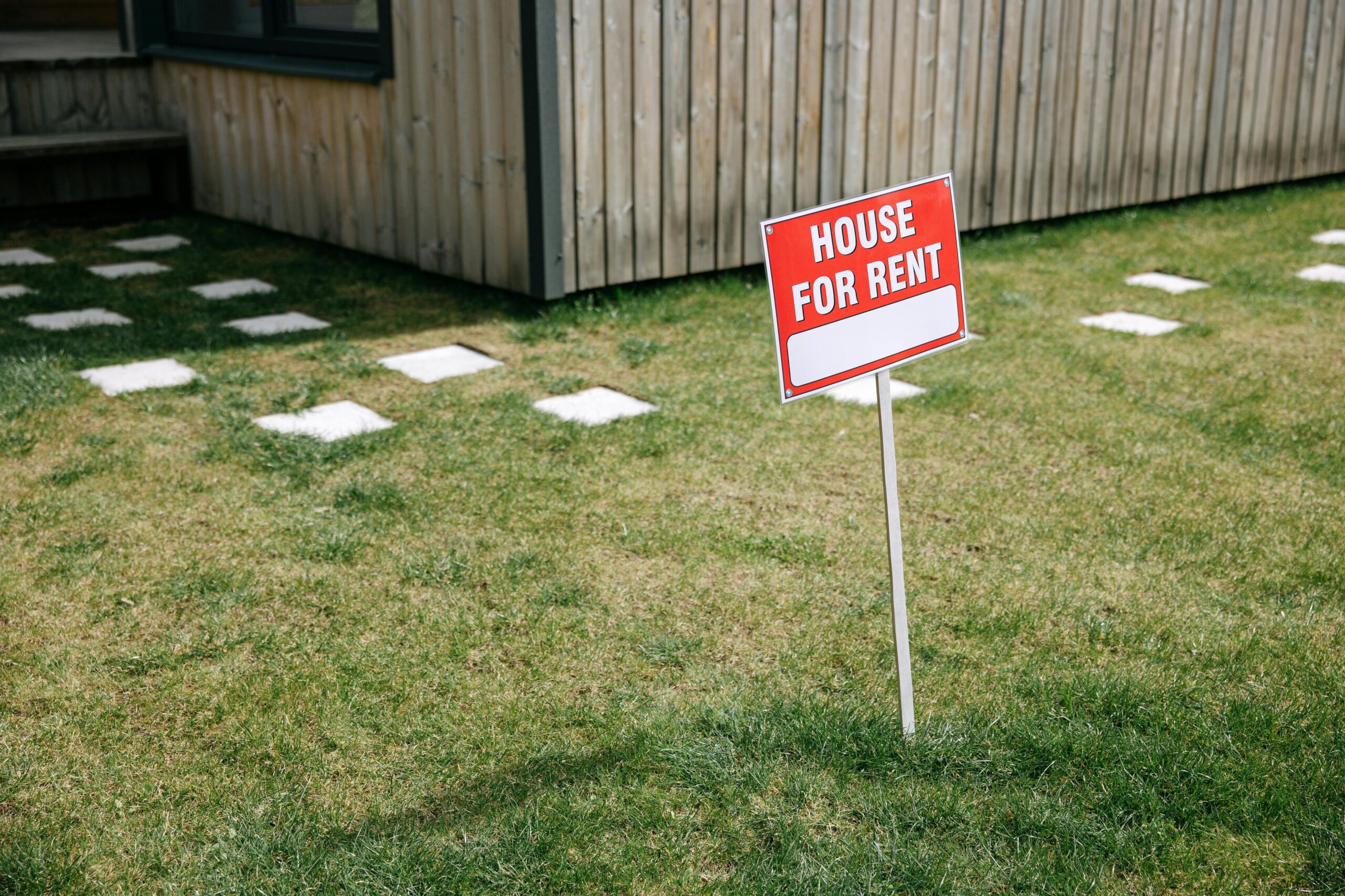 pcm rental house with a for rent sign outside