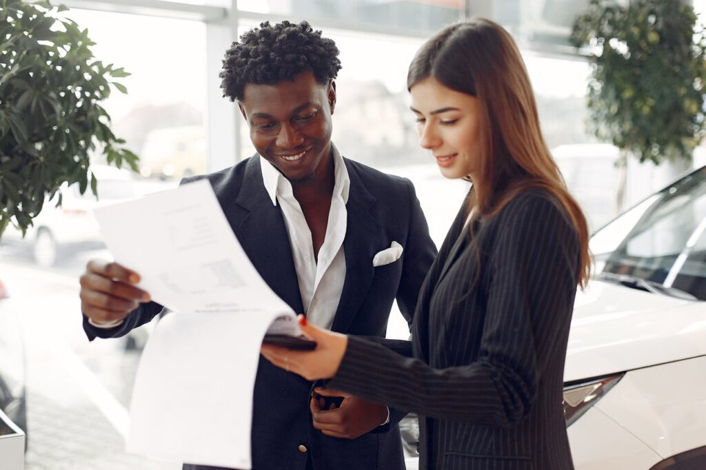 Two people reviewing a memorandum of sale - Assets For Life