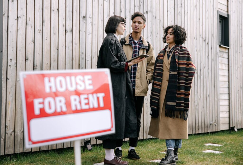 Couple looking at a house to rent with an estate agent - Assets For Life