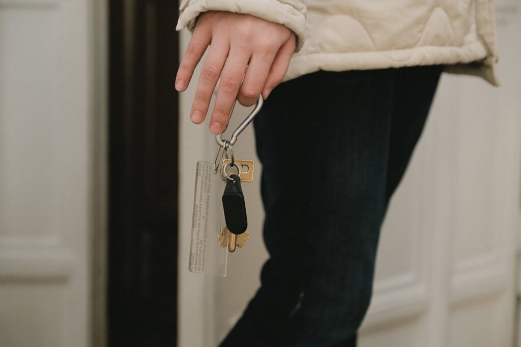 Woman holding house keys for a periodic tenancy - Assets For Life