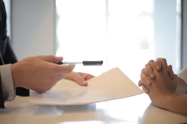 Couple reviewing mortgage paperwork - Assets For Life