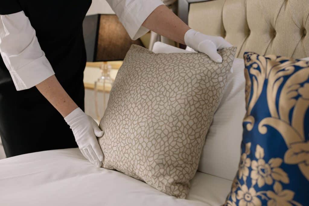 Person cleaning serviced accommodation - Assets For Life