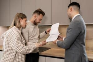 Estate agent showing couple a buy to let property - Assets For Life