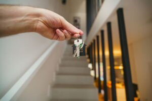 first time home owner holding keys - Assets For Life