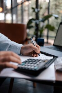 Person making calculations online - Assets For Life