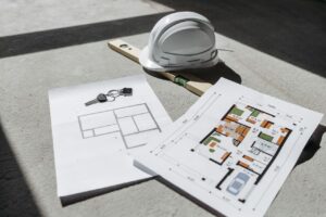Architectural floor plans with helmet and keys - Assets For Life