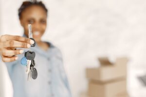 Lady with keys to rental property - Assets For Life