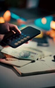 Person using phone calculator - Assets For Life
